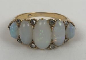 A gold and five stone opal ring, ring size N