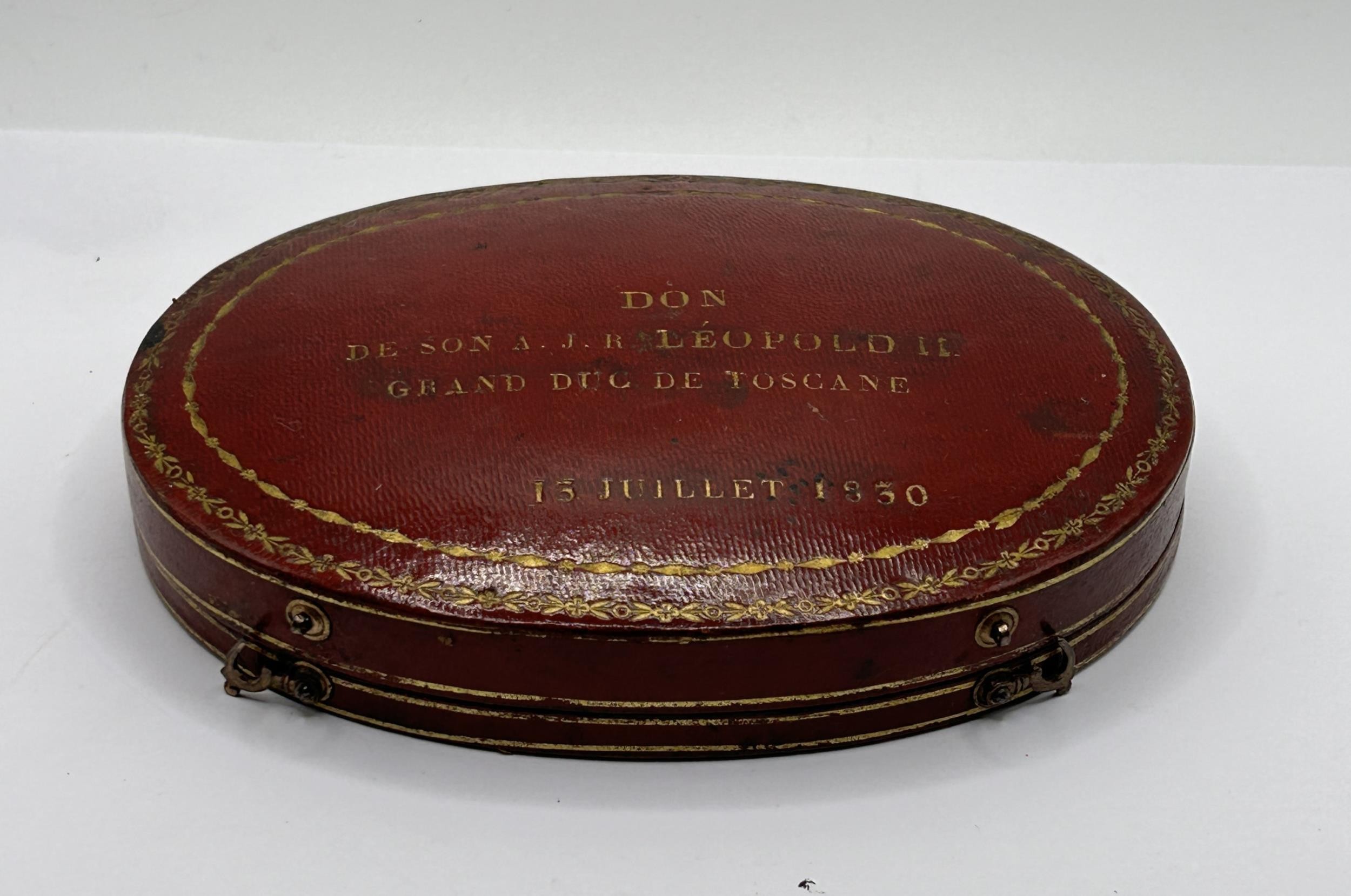 An early/mid 19th century French oval box, to hold two pocket watches, the cover tooled in gilt 'DON - Image 2 of 5
