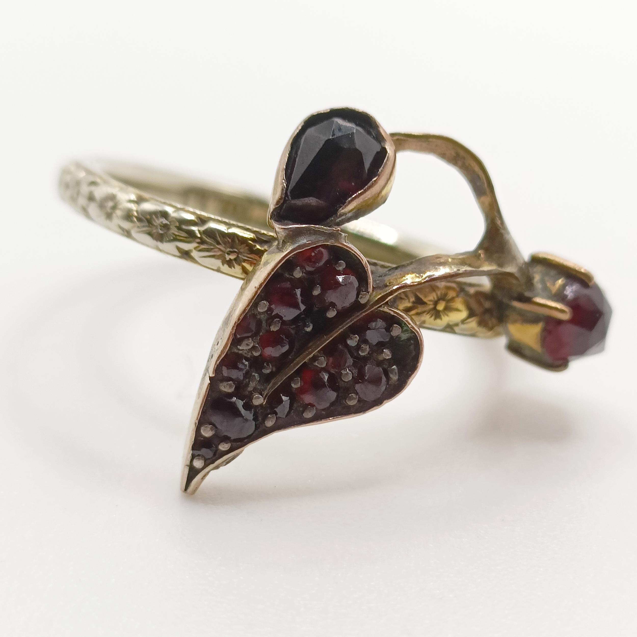 A platinum wedding band, ring size K, and a 18ct gold wedding band, with a garnet mount added, - Image 3 of 7