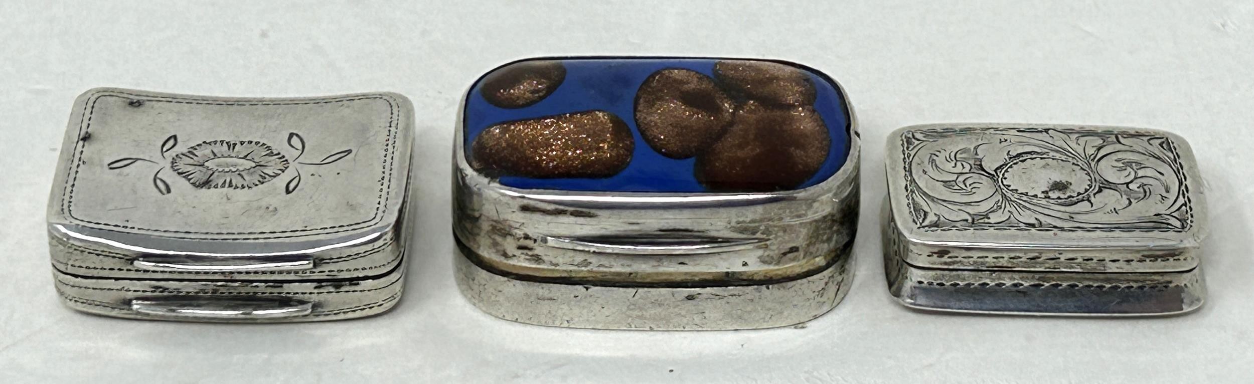 A 19th century silver vinaigrette, marks rubbed, another, and a silver and enamel vinaigrette (3)