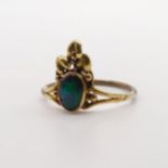 An Arts and Crafts yellow coloured metal and opal ring, by Jean Bassett, size J 1/2 Provenance: