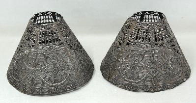 A pair of Continental silver coloured metal pierced lampshades, 16 cm diameter Various losses 5.8