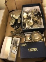 A silver plated two handle tray, assorted silver plated flatwares and a mirror