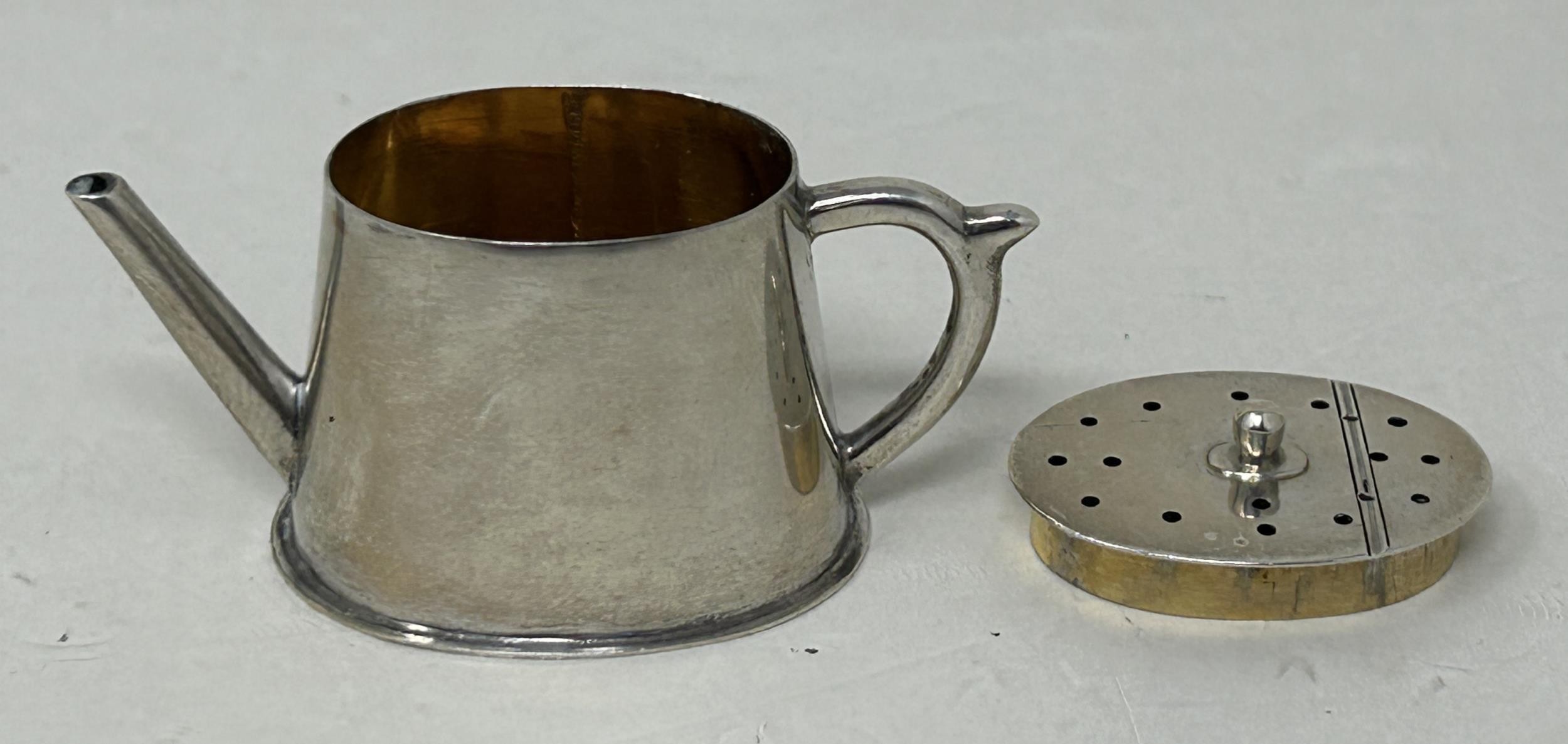 A late Victorian novelty pepper, in the form of a teapot, London 1898, and another, in the form of a - Image 2 of 5