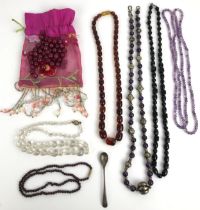 An amber coloured necklace, and assorted costume jewellery