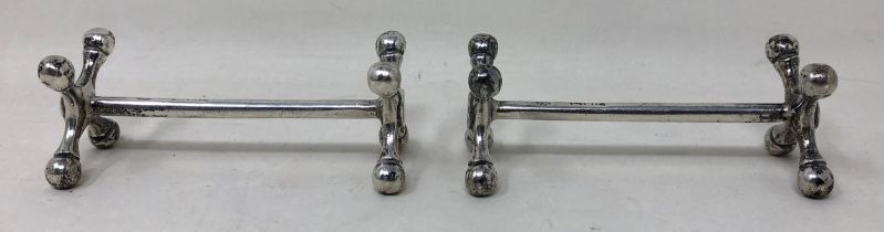 A pair of late Victorian silver knife rests, London 1900, 3 ozt