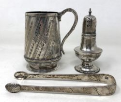 A pair of silver bright cut sugar tongs, a silver pepper pot, and a silver christening cup, 6.6