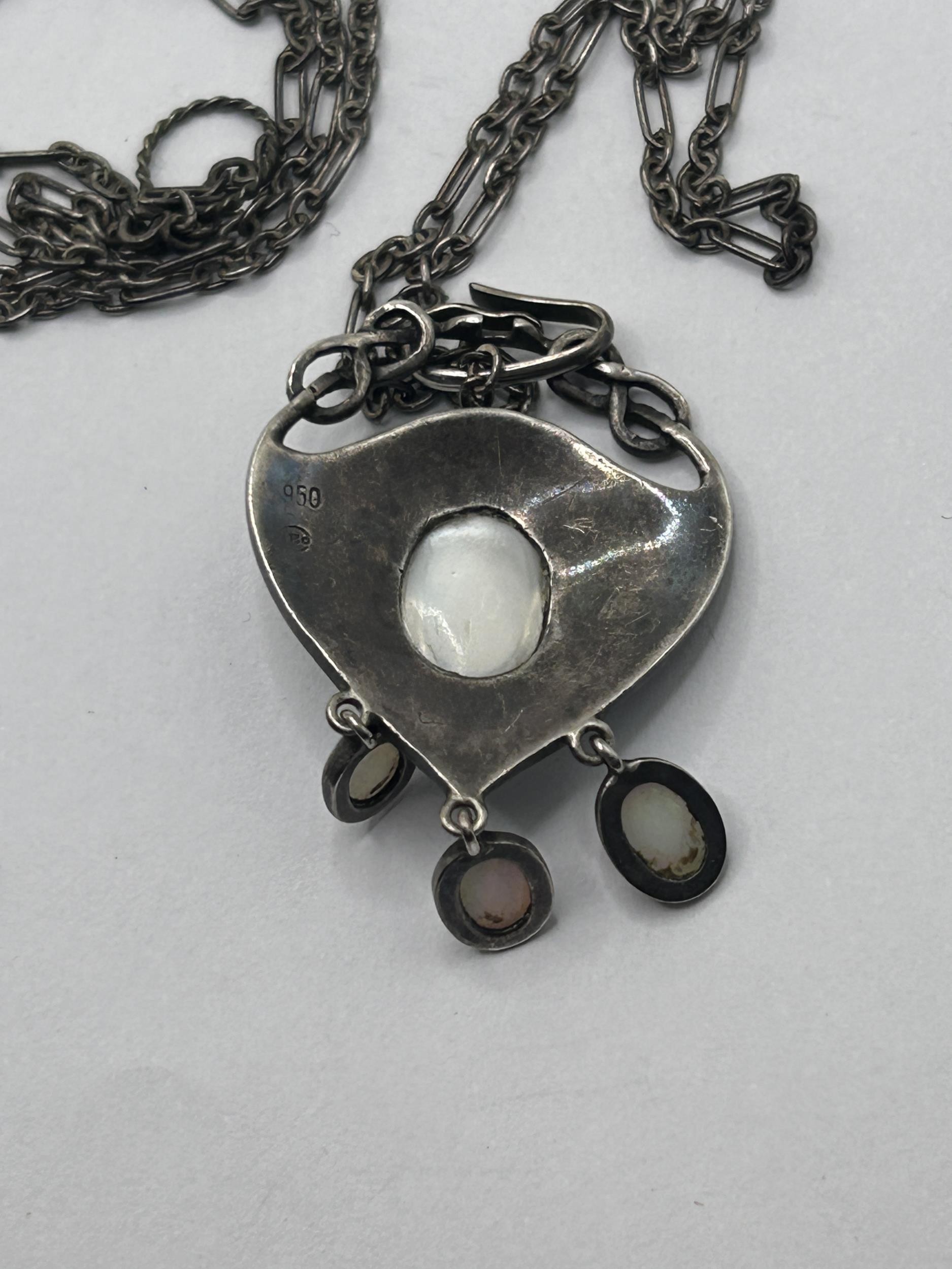 An Art Nouveau pewter and oval moonstone pendant, on a chain, with a receipt from Didier Antiques, - Image 3 of 5