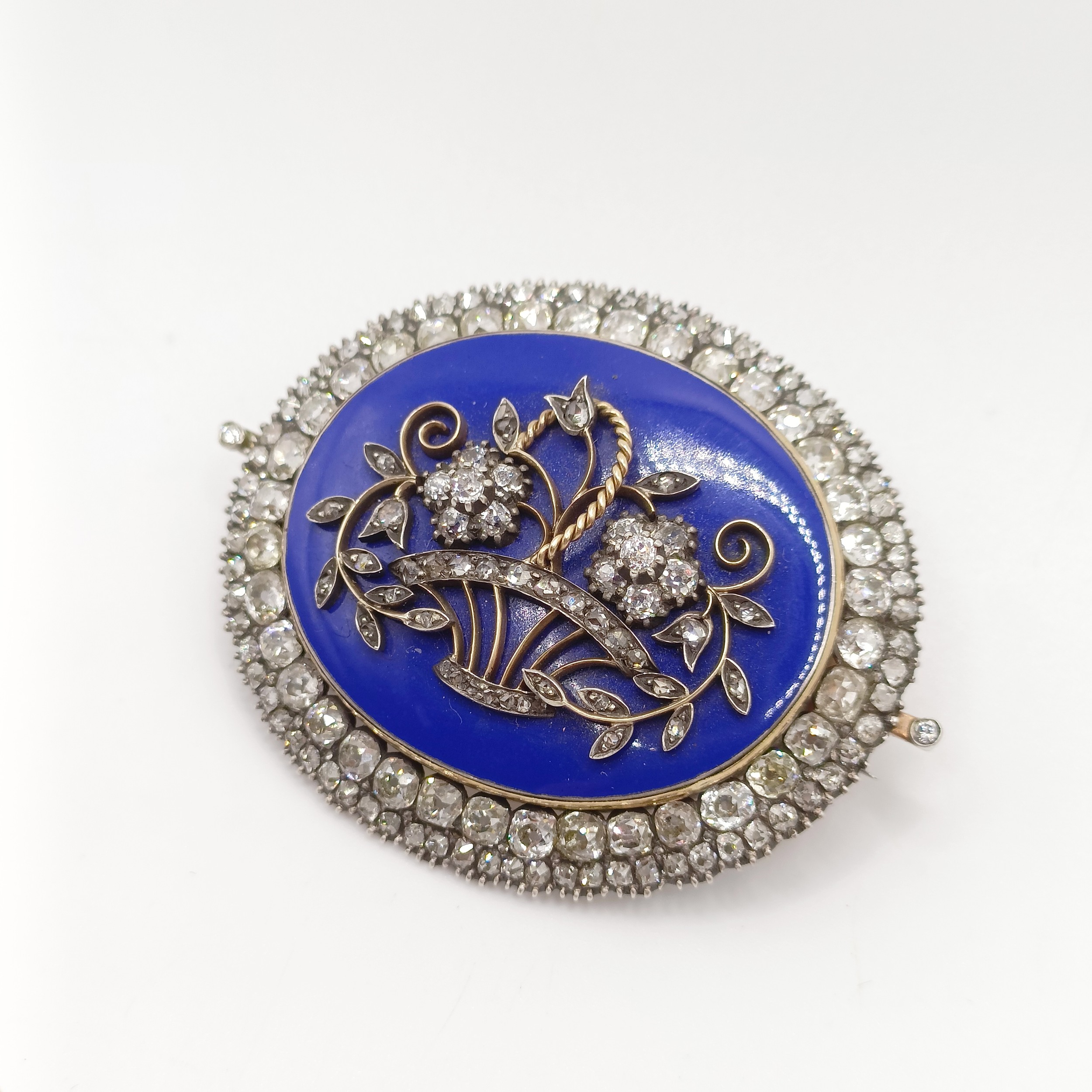 An early 19th French diamond, blue enamel, yellow and white metal oval brooch, decorated a basket of - Image 4 of 6