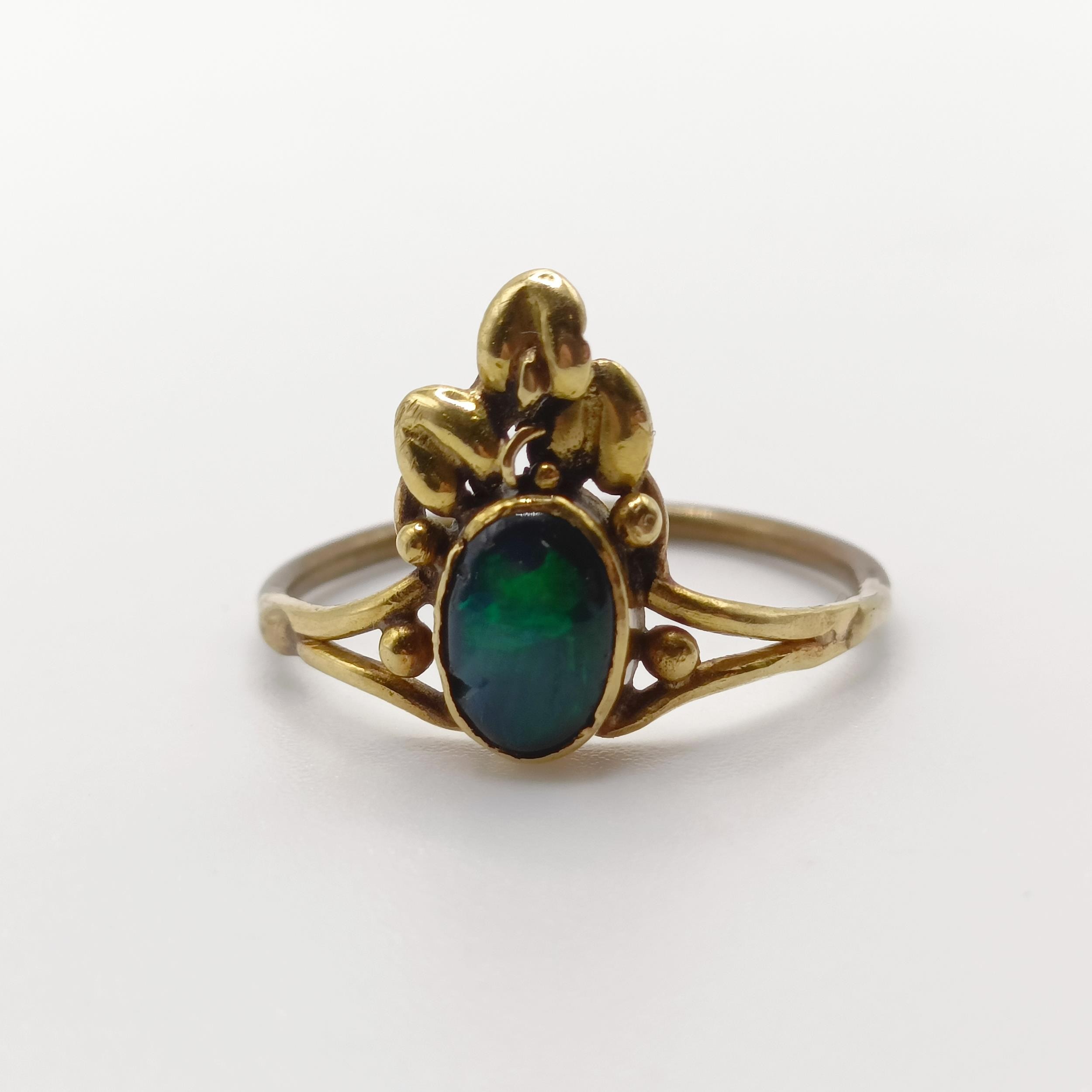 An Arts and Crafts yellow coloured metal and opal ring, by Jean Bassett, size J 1/2 Provenance: - Image 4 of 6