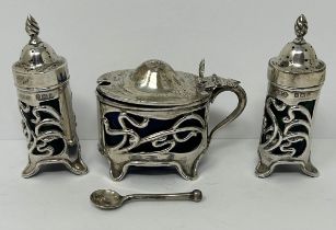 An Art Nouveau silver three piece cruet set, Birmingham 1907