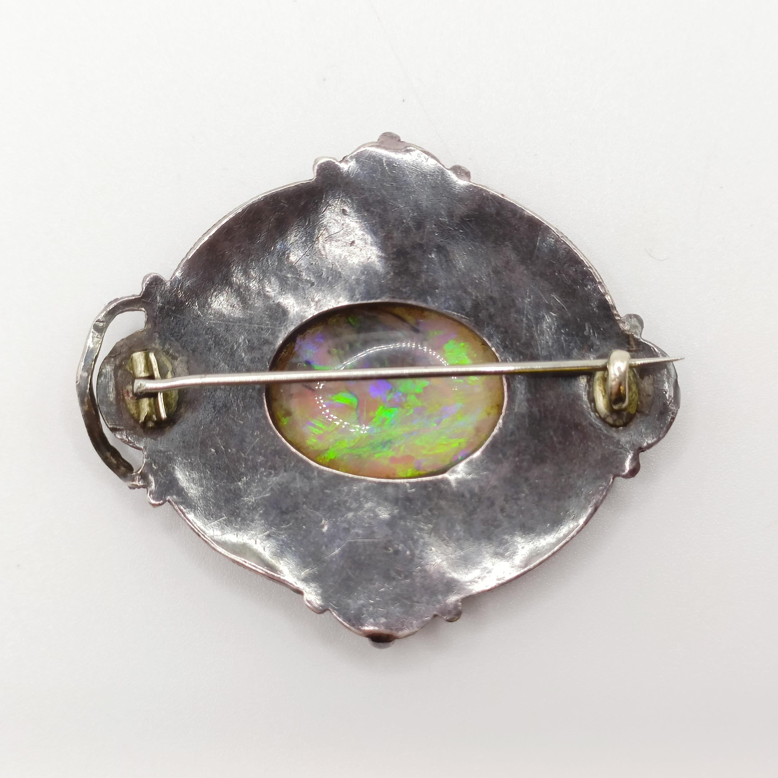 An Arts and Crafts silver coloured metal, opal, green stone and enamel brooch, by Jean Bassett - Image 4 of 5