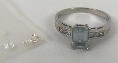 An aquamarine ring, with diamond shoulders, and assorted loose white stones, ring size N