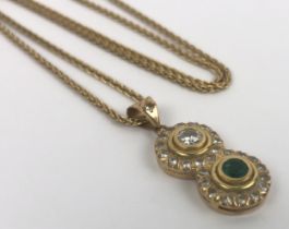 An emerald and diamond pendant, on a 18ct gold chain Emerald and diamond untested, emerald may be