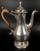 A George III silver coffee pot, with a turned wooden handle, London 1769, 26.5 ozt, all in 26.5 ozt