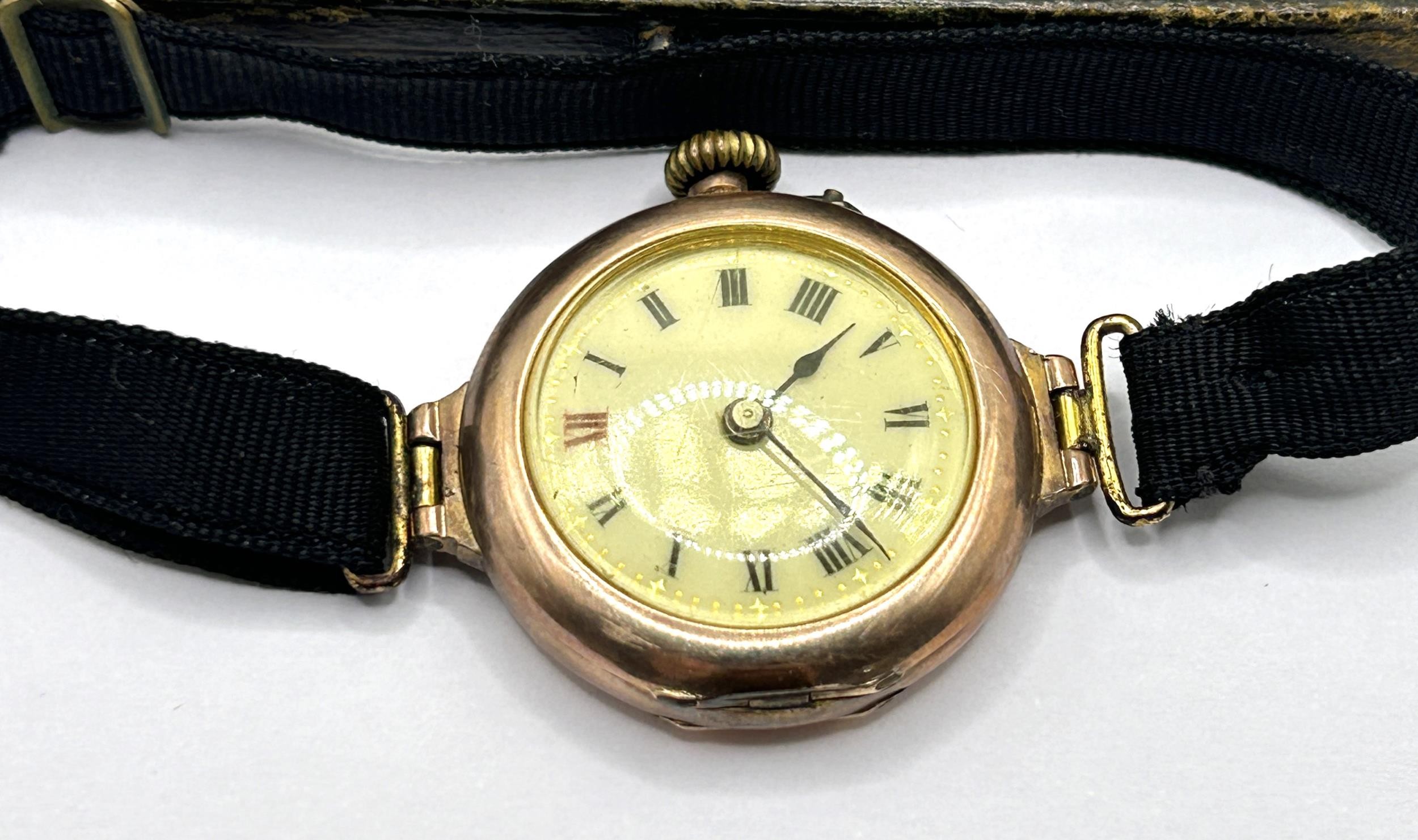 A ladies yellow coloured metal wristwatch, on a silk strap, with a worn vintage watch box, and a - Image 2 of 6