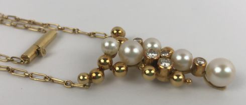 An 18ct gold, pearl and diamond pendant, on a chain