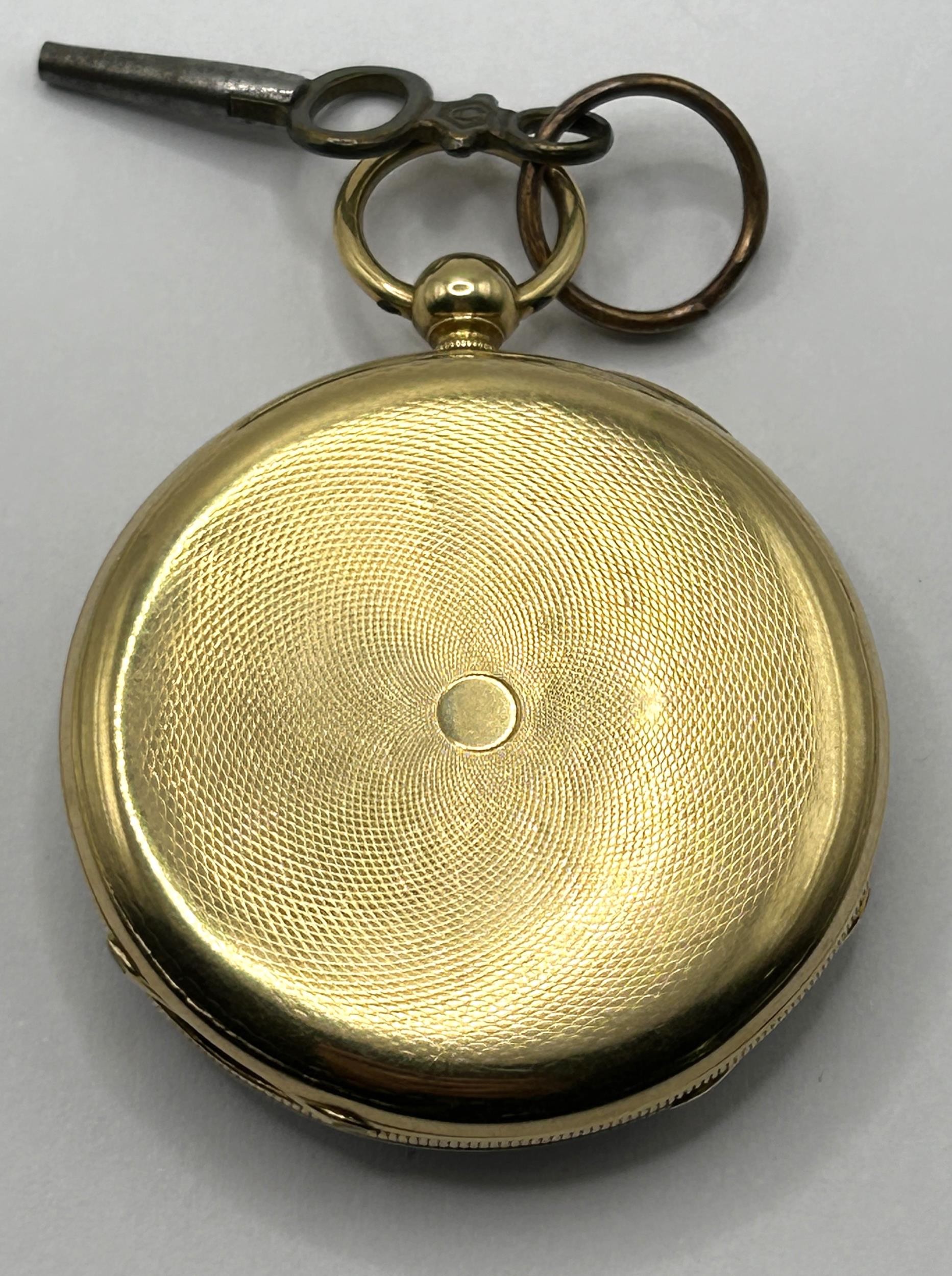 An 18ct gold open face pocket watch, the enamel dial with Roman numerals, the dust cap with engraved - Image 2 of 5
