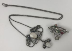 An Art Nouveau style silver and paste set brooch, and an Art Nouveau style silver and shell necklace