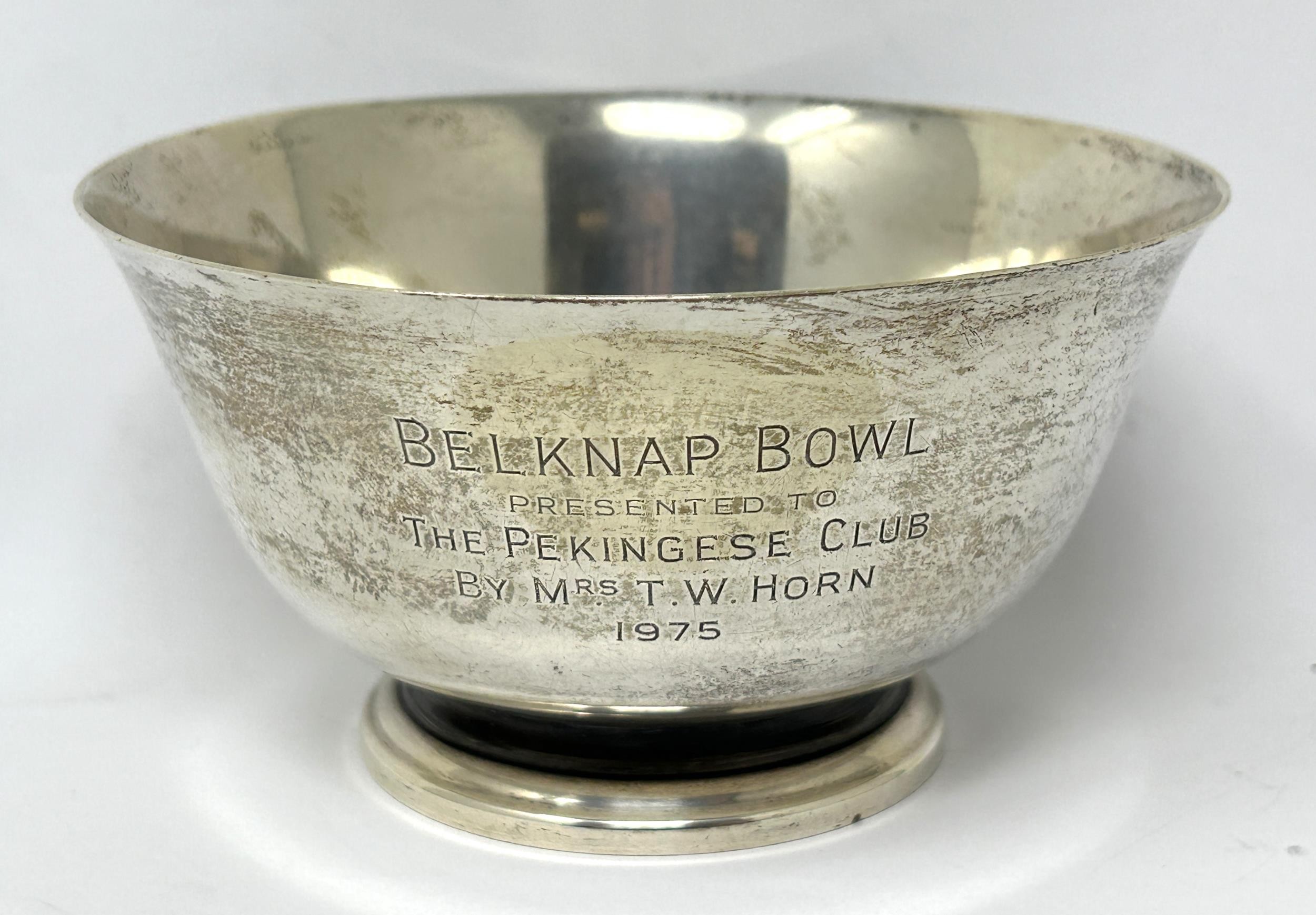 A sterling silver sugar bowl, with a presentation inscription dated 1975 4.1 ozt