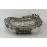 A silver coloured metal pierced swing handled basket 10.4 ozt