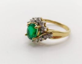 An 18ct gold, emerald and diamond ring, ring size L