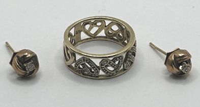 A 9ct gold, diamond chip pierced ring, ring size M, 3.1 g, and a pair of yellow metal and diamond