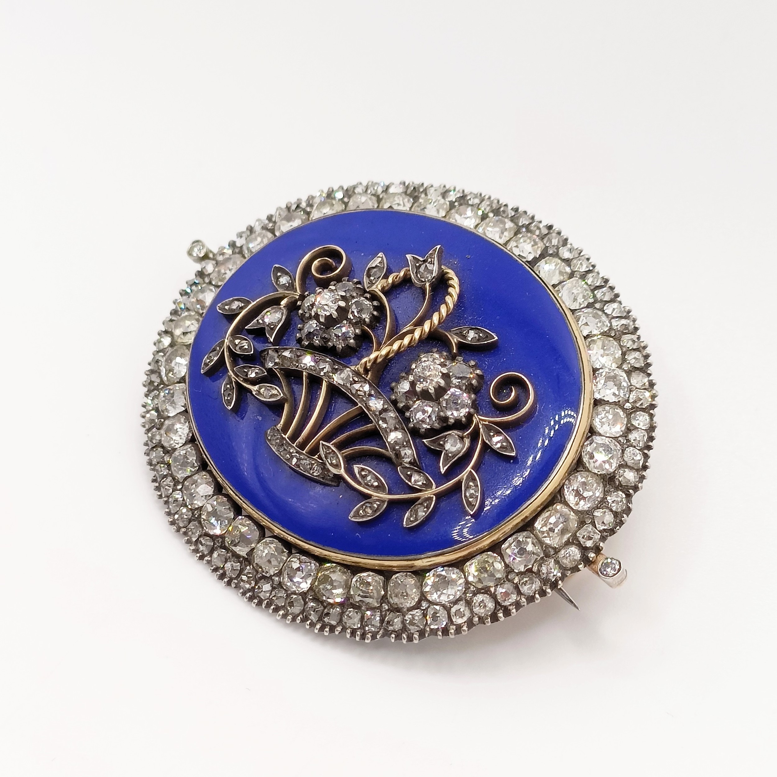 An early 19th French diamond, blue enamel, yellow and white metal oval brooch, decorated a basket of - Image 3 of 6