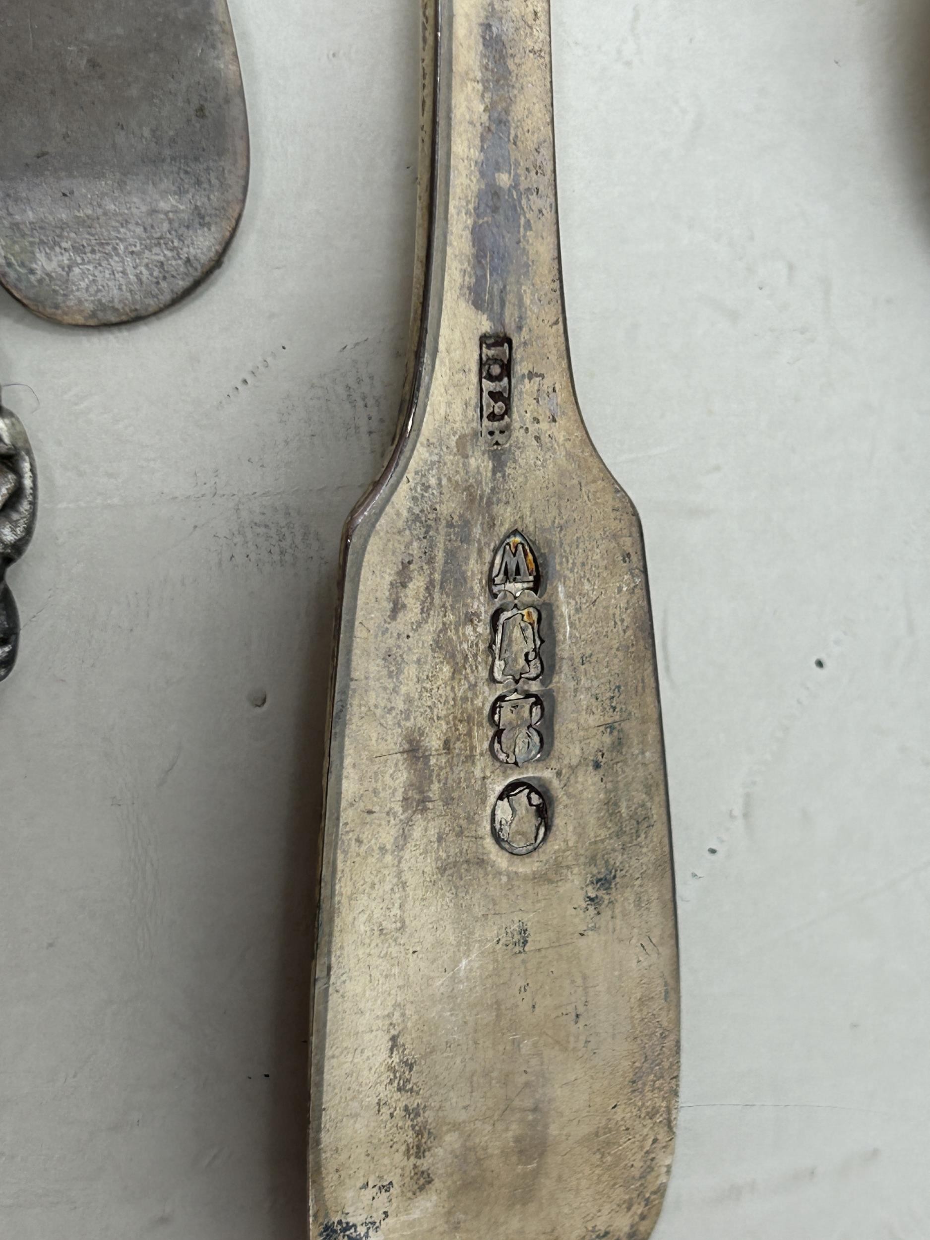 An Indian silver coloured metal sugar bowl, assorted teaspoons, a napkin ring, a pair of pierced - Image 3 of 5