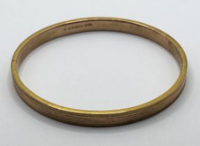 A 9ct gold bangle, 9.4 g