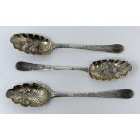 A pair of George III silver spoons, later decorated, and another spoon, 5.6 ozt (3)