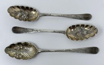 A pair of George III silver spoons, later decorated, and another spoon, 5.6 ozt (3)