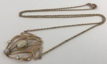 An Art Nouveau style opal pendant, on a chain Approx. overall length, including clasp: 50 cm