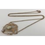 An Art Nouveau style opal pendant, on a chain Approx. overall length, including clasp: 50 cm