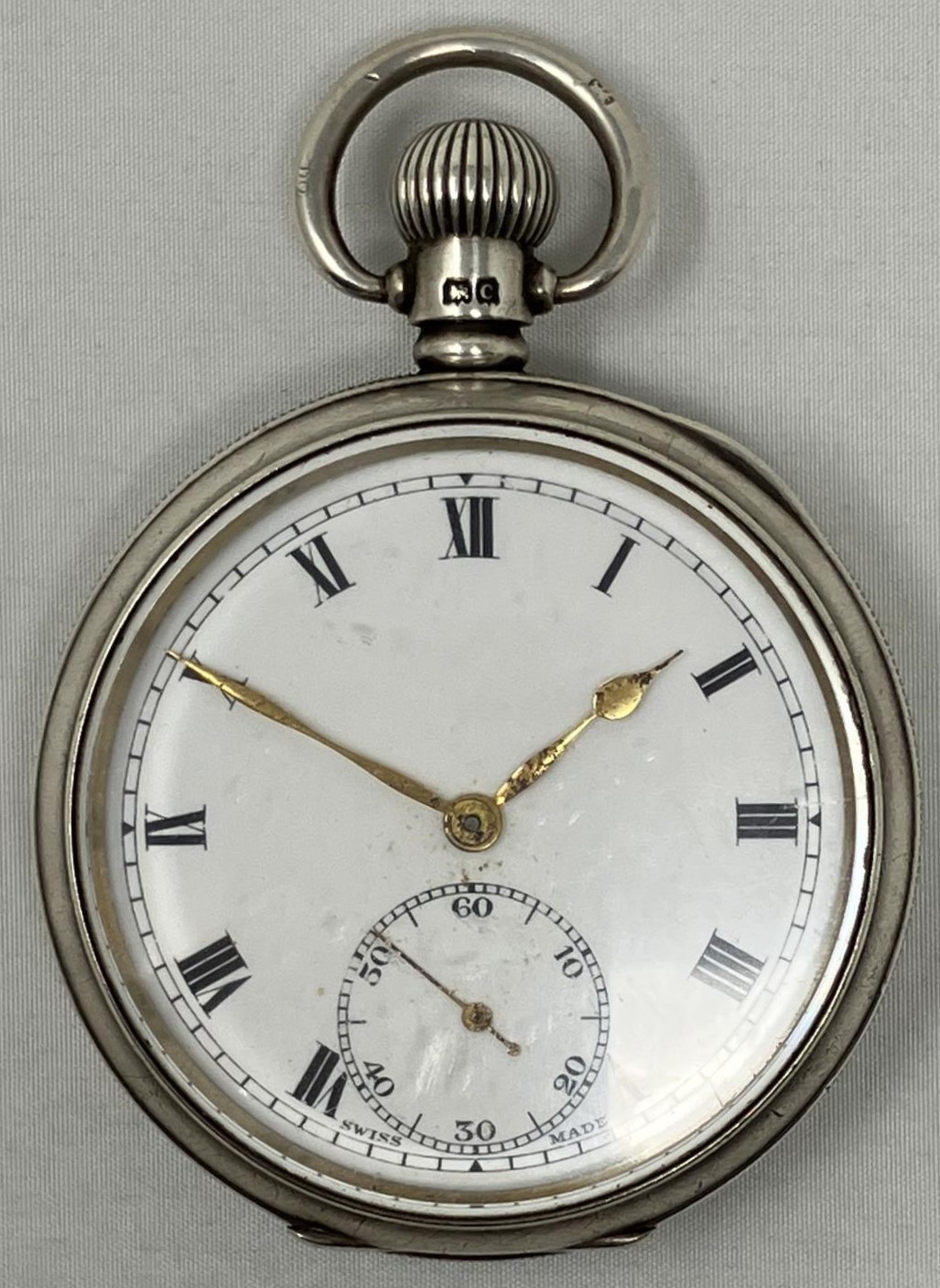 A silver open face pocket watch