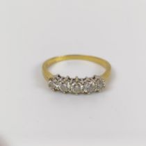 An 18ct gold and five stone diamond ring, ring size T Diamonds white and bright, no visable