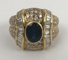 An 18ct gold, sapphire and diamond ring, ring size K