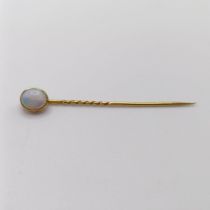 An opal stick pin