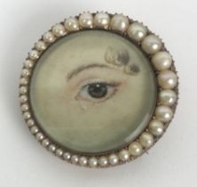 A lover's eye brooch, in a yellow coloured metal and seed pearl mount, 3 cm wide Ivory Exemption