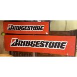 A metal sign, Bridgestone, 46 x 182 cm, and another. 30.5 x 122 cm (2)