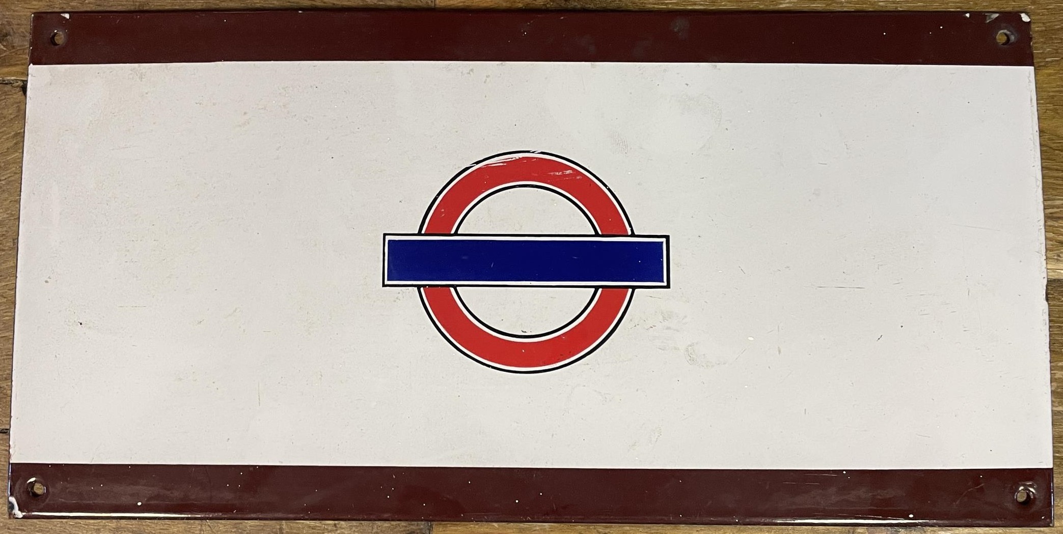 An enamel London Underground sign, 23 x 46 cm