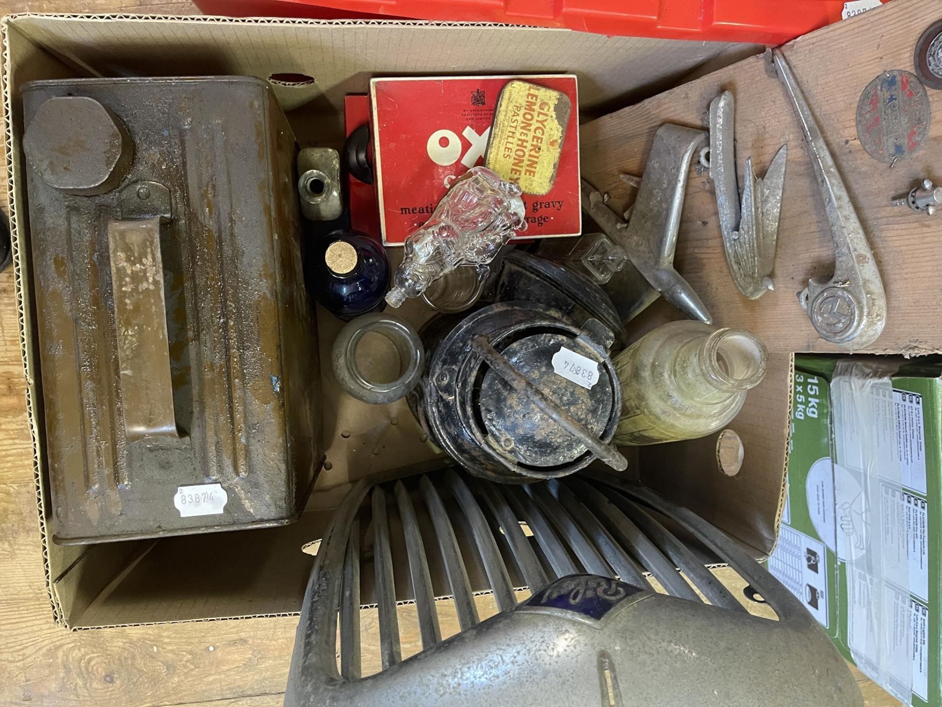 Various car bonnet emblems, badges, a Riley radiator surround grill, a lamp, fuel can, bottles and - Image 2 of 2