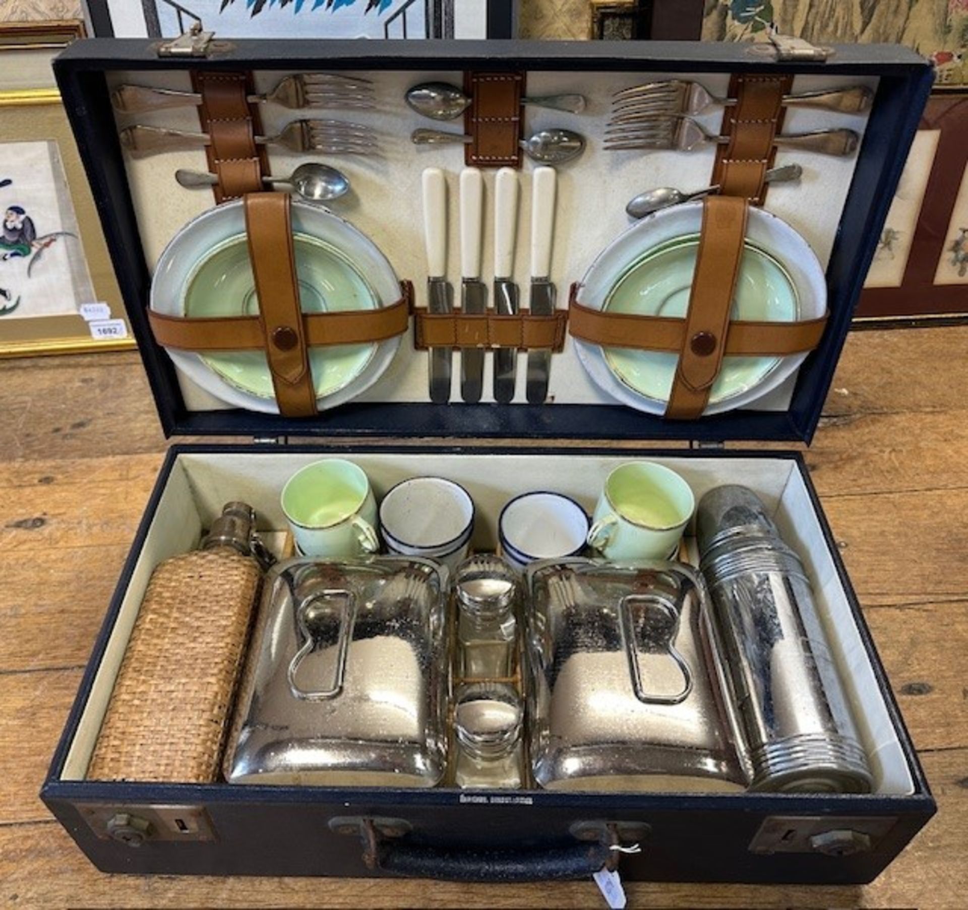 A four piece picnic set, the Finnigans rexine covered case opening to reveal a fitted interior