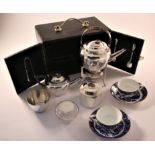 An early 20th century travelling two person picnic set, circa 1900-1904, the silver plated set by