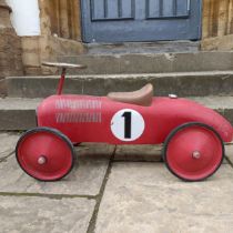 A child's push along racing car