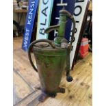 A green painted forecourt oil pump, 66 cm high