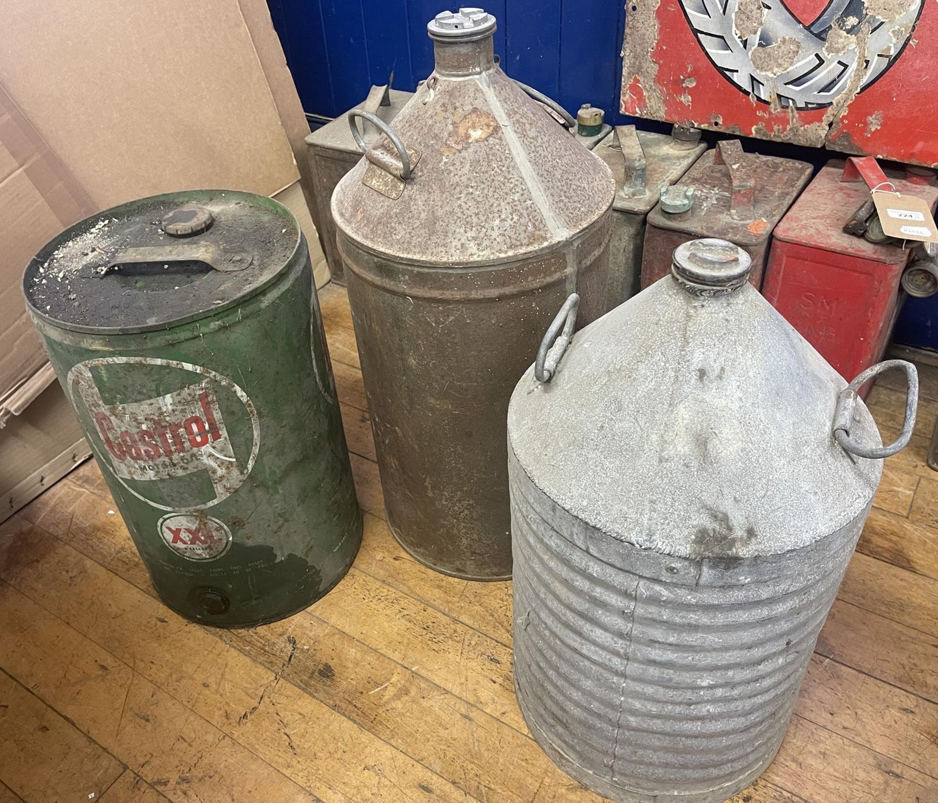 A Castrol XXL five gallon can, and two other five gallon cans (3)