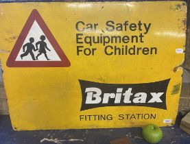 An enamel sign, Britax Fitting Station, Car Safety Equipment for Children, 56 x 76 cm A little