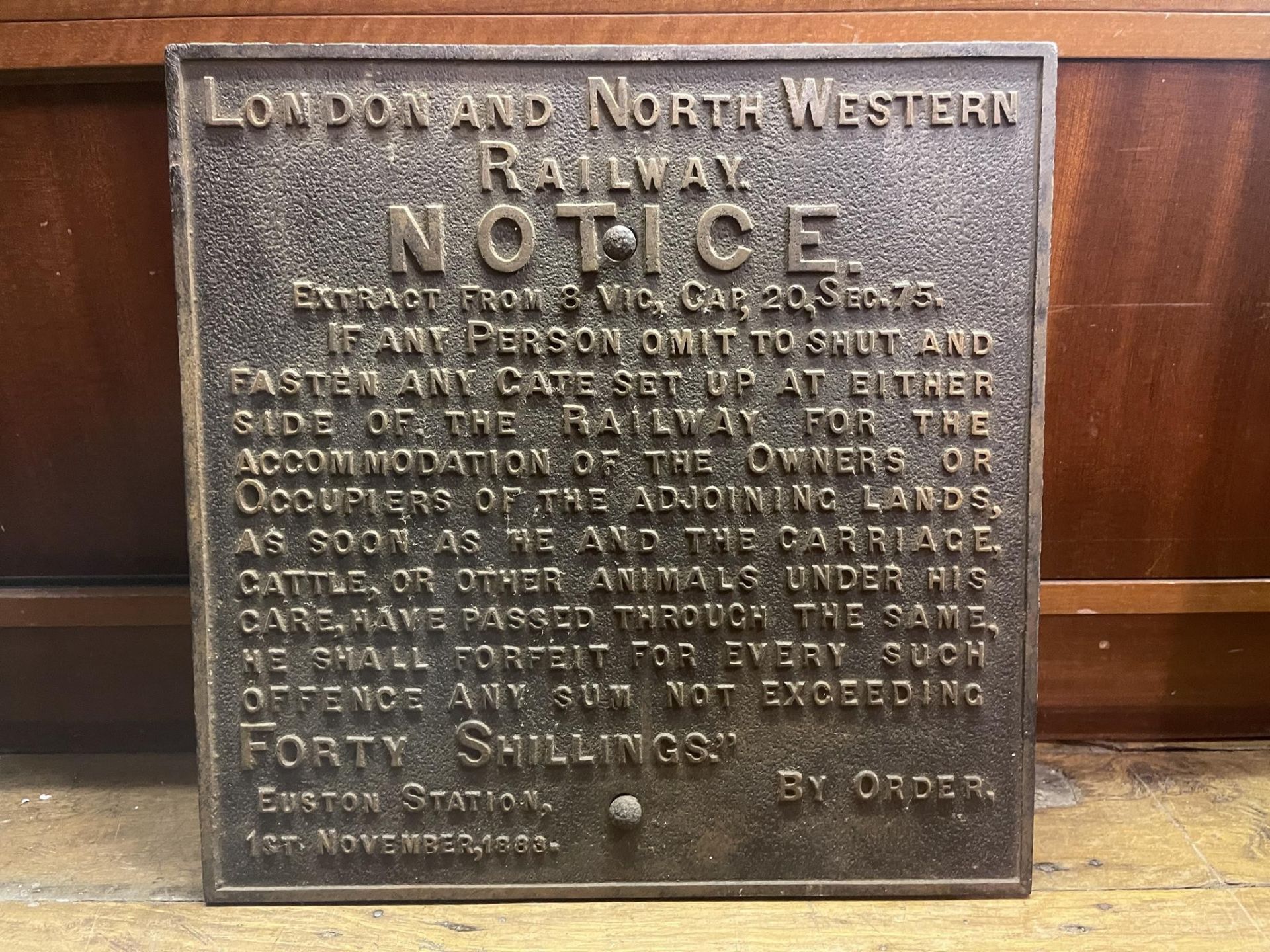 A cast iron sign, London and North Western Railway Notice, noted Euston Station 1st November,