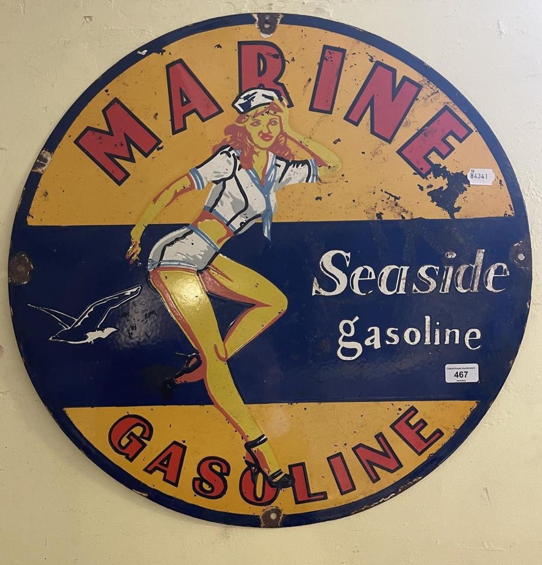 An enamel sign Marine Seaside Gasoline, 60.5 cm diameter some loss/damage